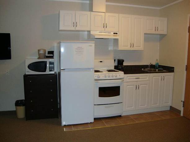 Imagen de la habitación del Hotel Perfect Inns And Suites. Foto 13