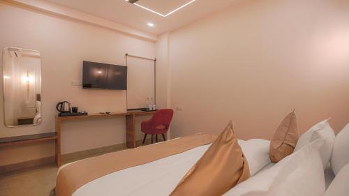 Imagen de la habitación del Hotel Perfectstayz premium Varanasi. Foto 19