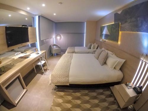 Imagen de la habitación del Hotel Perla Suite. Foto 6