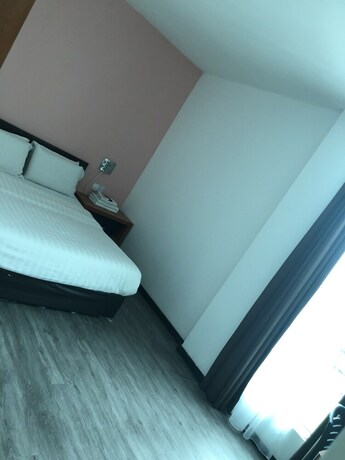 Imagen de la habitación del Hotel Permai Hotel. Foto 17