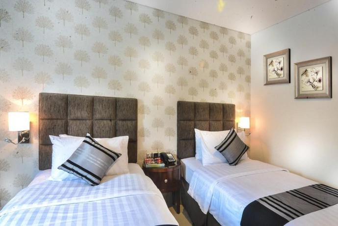 Imagen de la habitación del Hotel Permata, Bogor. Foto 6