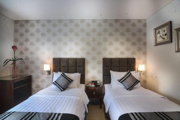 Imagen de la habitación del Hotel Permata, Bogor. Foto 7