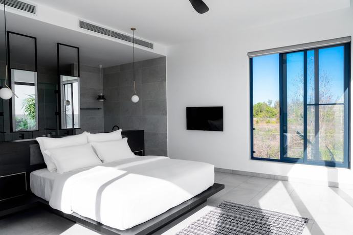 Imagen de la habitación del Hotel Perolas Villas Resort. Foto 14