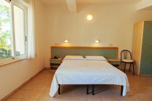 Imagen de la habitación del Hotel Perrozzi. Foto 8