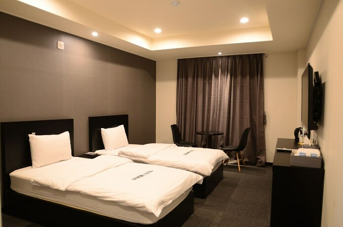 Imagen de la habitación del Hotel Persimmon Tourist. Foto 21