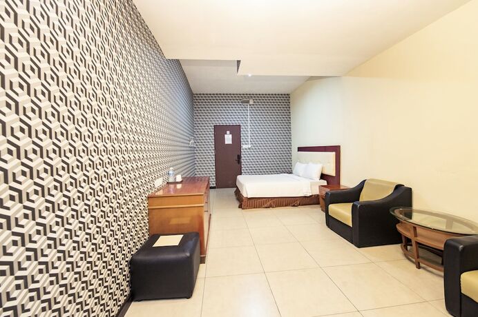 Imagen de la habitación del Hotel Pertama Lodge. Foto 15