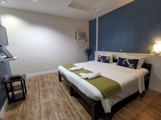 Imagen de la habitación del Hotel Pescadores Seaview Suites. Foto 23