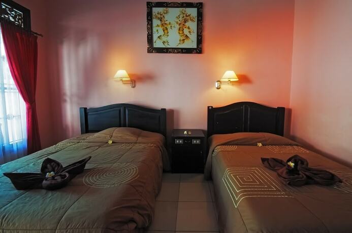 Imagen de la habitación del Hotel Pesona Beach Inn. Foto 27