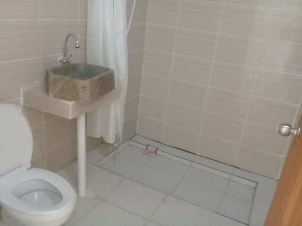 Imagen de la habitación del Hotel Pesona Restaurant and Room. Foto 29