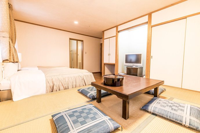 Imagen de la habitación del Hotel Petit Enchante. Foto 2