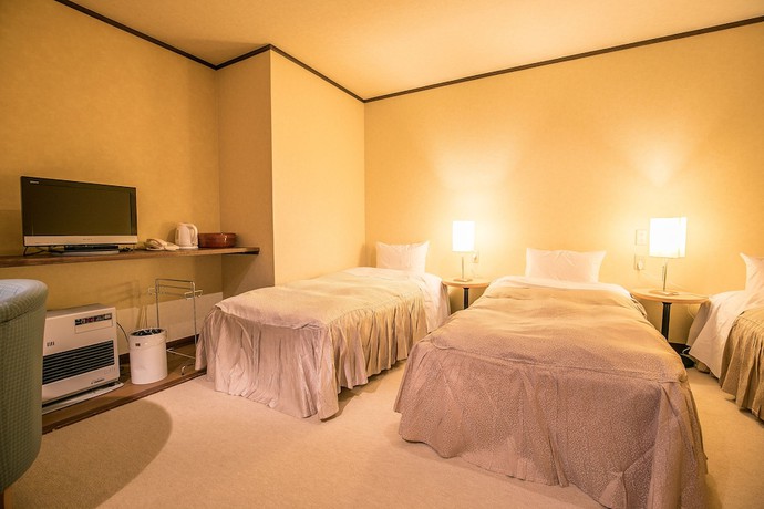 Imagen de la habitación del Hotel Petit Enchante. Foto 8