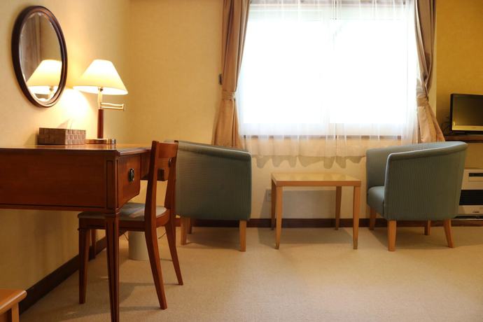 Imagen de la habitación del Hotel Petit Enchante. Foto 9