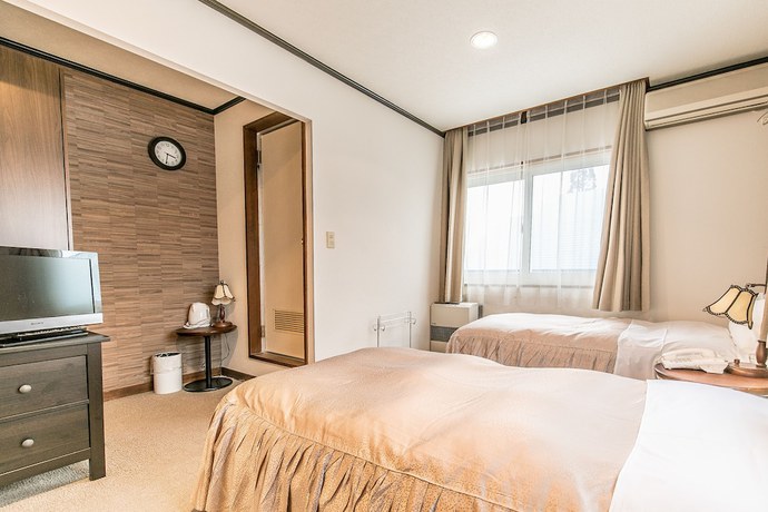 Imagen de la habitación del Hotel Petit Enchante. Foto 10