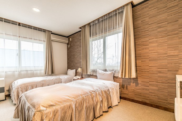 Imagen de la habitación del Hotel Petit Enchante. Foto 12