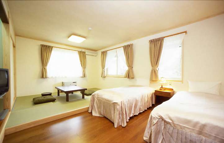 Imagen de la habitación del Hotel Petit Enchante. Foto 13