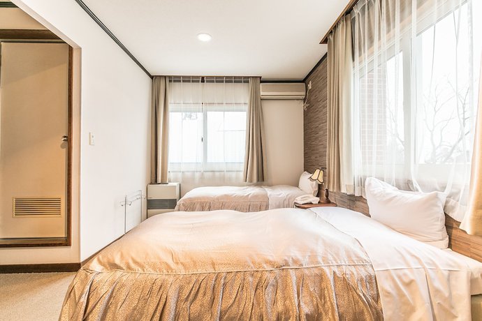Imagen de la habitación del Hotel Petit Enchante. Foto 16
