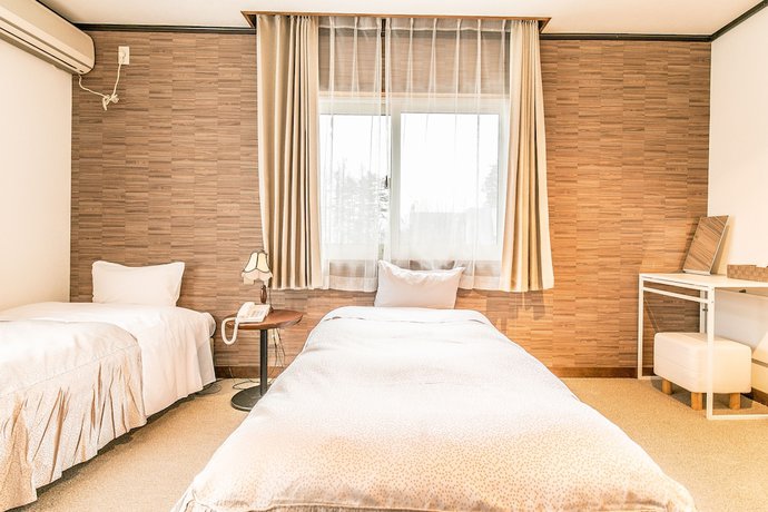 Imagen de la habitación del Hotel Petit Enchante. Foto 18