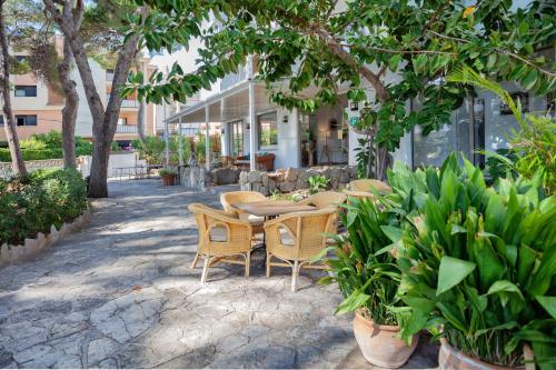 Imagen del bar/restaurante del Hotel Petit Garden by Flacalco. Foto 2