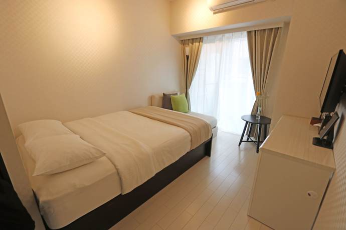 Imagen de la habitación del Hotel Petit Grande Homes. Foto 3
