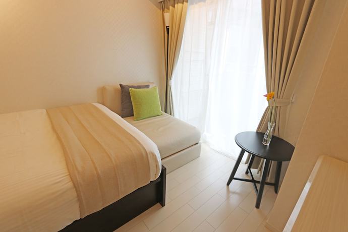 Imagen de la habitación del Hotel Petit Grande Homes. Foto 5