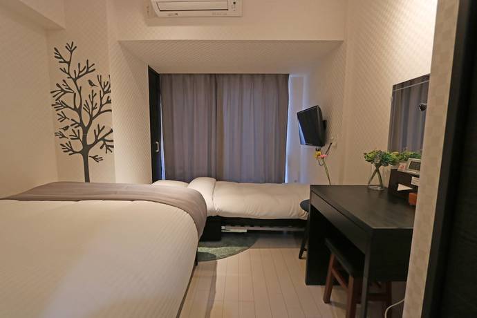Imagen de la habitación del Hotel Petit Grande Homes. Foto 6