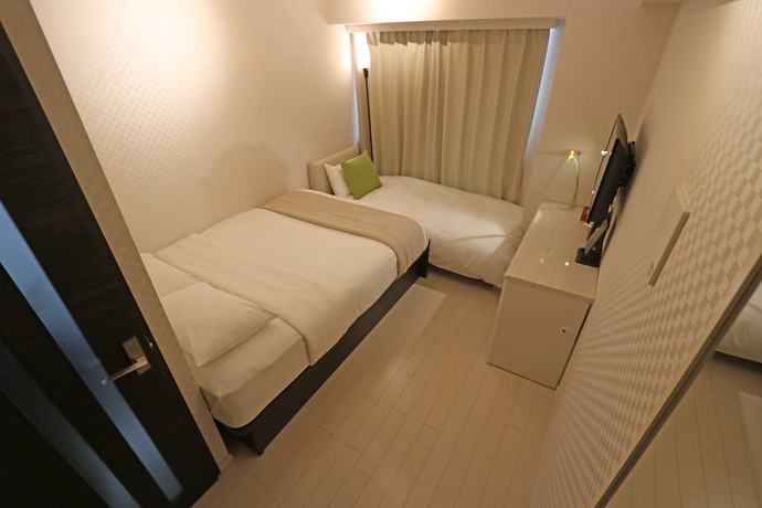 Imagen de la habitación del Hotel Petit Grande Homes. Foto 7