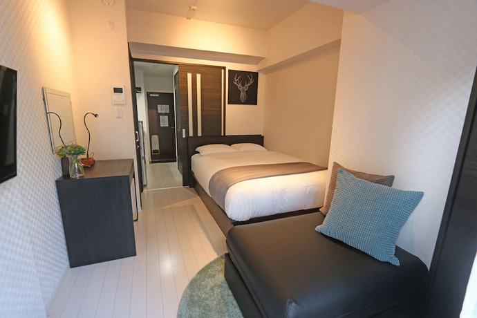 Imagen de la habitación del Hotel Petit Grande Homes. Foto 10