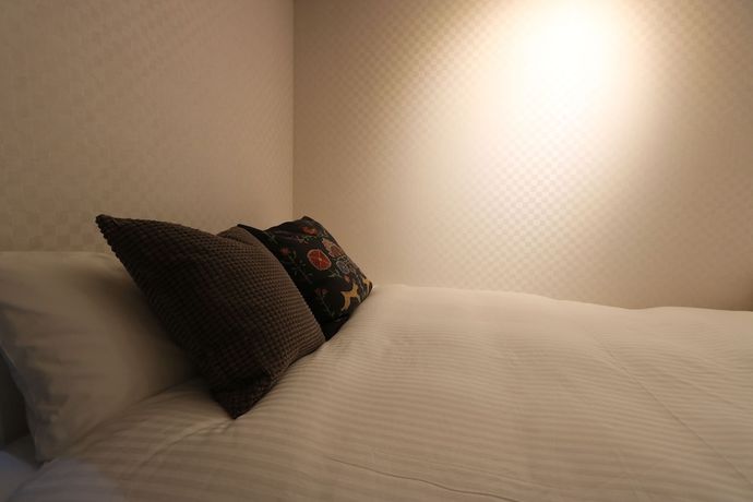 Imagen de la habitación del Hotel Petit Grande Homes. Foto 12