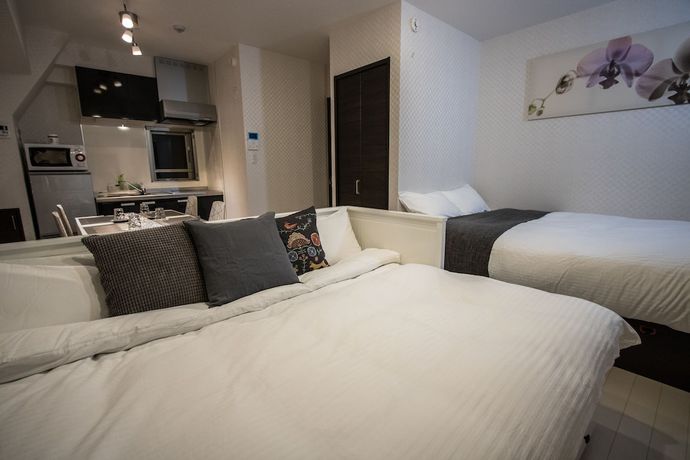 Imagen de la habitación del Hotel Petit Grande Homes. Foto 13