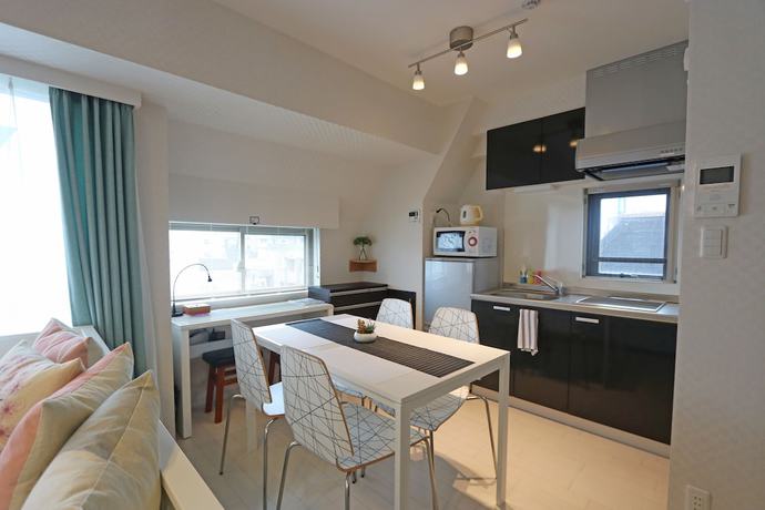 Imagen de la habitación del Hotel Petit Grande Homes. Foto 17