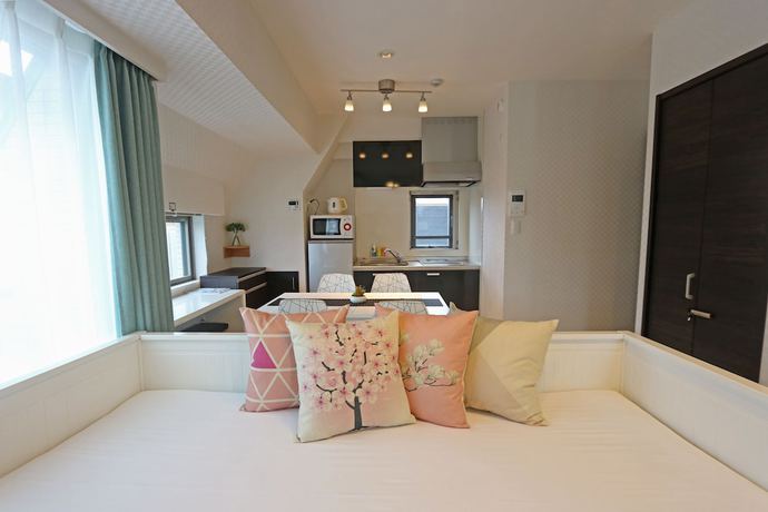 Imagen de la habitación del Hotel Petit Grande Homes. Foto 19