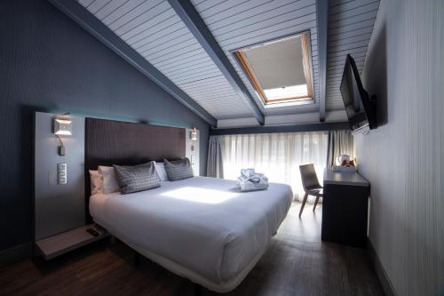Imagen de la habitación del Hotel Petit Palace Plaza Espa&ntilde;a. Foto 7