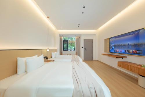 Imagen de la habitación del Hotel Phoenix Ancient City Courtyard凤凰古城庭院酒店. Foto 15