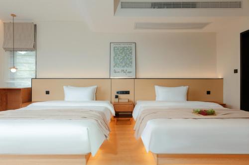 Imagen de la habitación del Hotel Phoenix Ancient City Courtyard凤凰古城庭院酒店. Foto 16