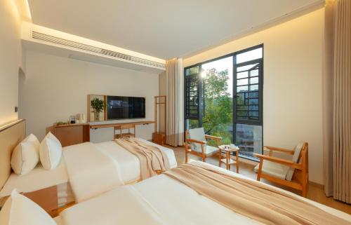 Imagen de la habitación del Hotel Phoenix Ancient City Courtyard凤凰古城庭院酒店. Foto 19