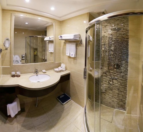 Imagen de la habitación del Hotel Phoenix Garden Hotel - Yantai. Foto 6