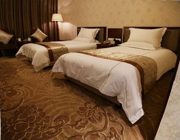 Imagen de la habitación del Hotel Phoenix Garden Hotel - Yantai. Foto 10