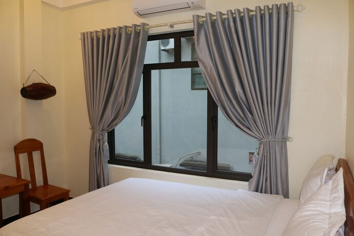 Imagen de la habitación del Hotel Phong Nha Coco Riverside Homestay. Foto 13