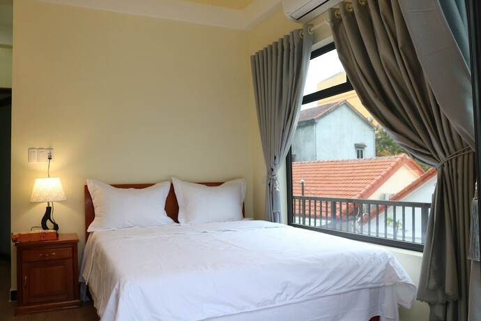 Imagen de la habitación del Hotel Phong Nha Coco Riverside Homestay. Foto 15