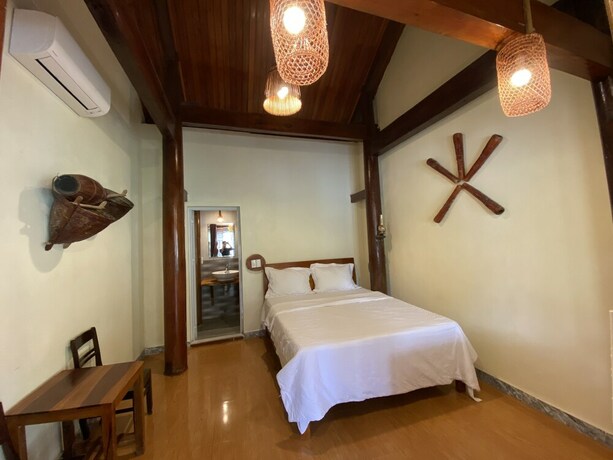 Imagen de la habitación del Hotel Phong Nha Coco Riverside Homestay. Foto 23