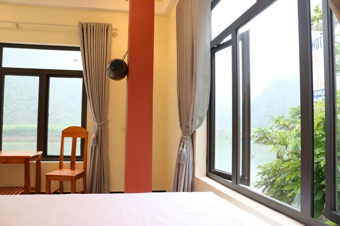 Imagen de la habitación del Hotel Phong Nha Coco Riverside Homestay. Foto 24