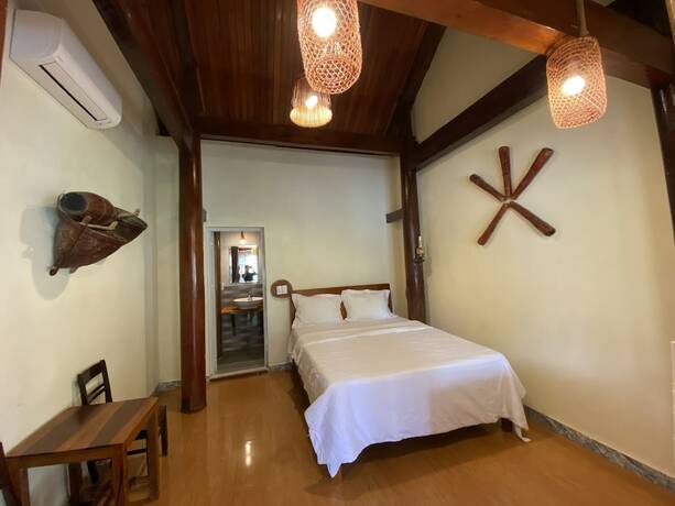 Imagen de la habitación del Hotel Phong Nha Coco Riverside Homestay. Foto 28