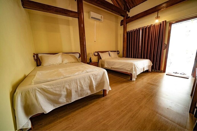 Imagen de la habitación del Hotel Phong Nha Coco Riverside Homestay. Foto 29