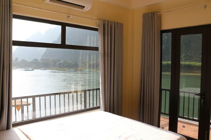 Imagen de la habitación del Hotel Phong Nha Coco Riverside Homestay. Foto 32