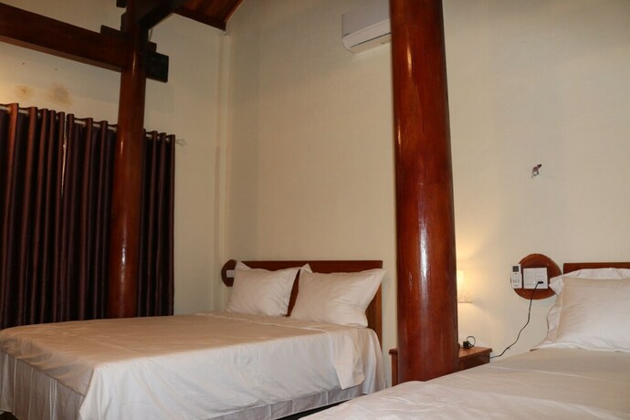 Imagen de la habitación del Hotel Phong Nha Coco Riverside Homestay. Foto 33