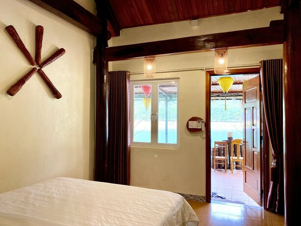 Imagen de la habitación del Hotel Phong Nha Coco Riverside Homestay. Foto 37