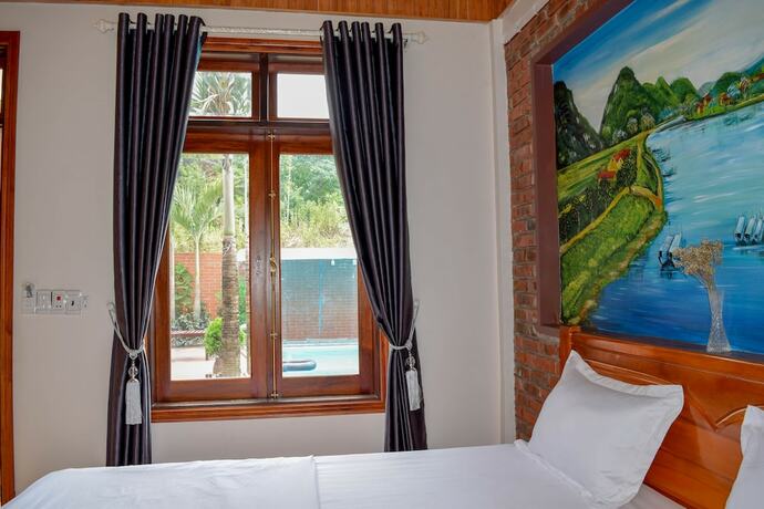 Imagen de la habitación del Hotel Phong Nha Hillside View Bungalow. Foto 17