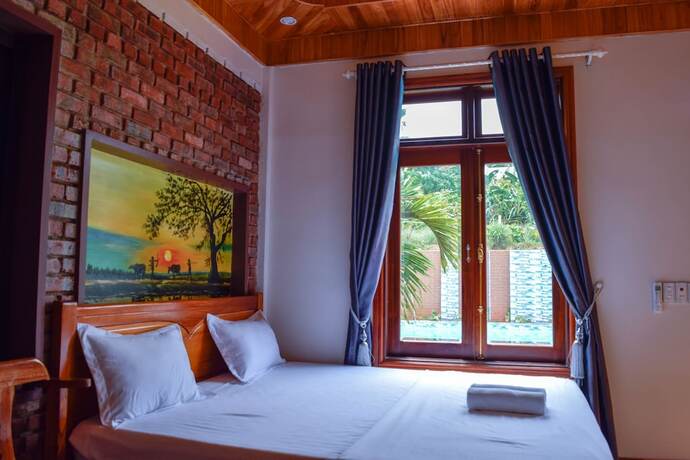 Imagen de la habitación del Hotel Phong Nha Hillside View Bungalow. Foto 22