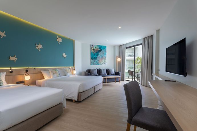 Imagen de la habitación del Hotel Phuket Emerald Beach Resort. Foto 14