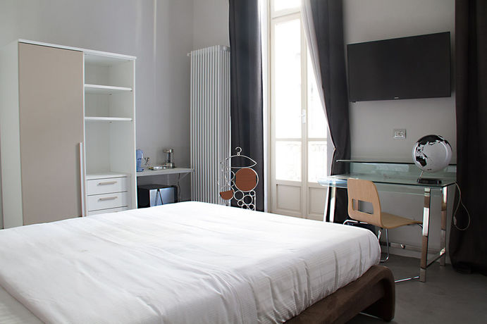 Imagen de la habitación del Hotel Piazza Castello Suite. Foto 11